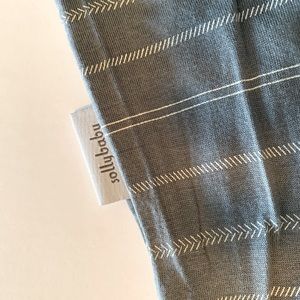 Solly baby wrap, grey and cream “French Ticking” pattern